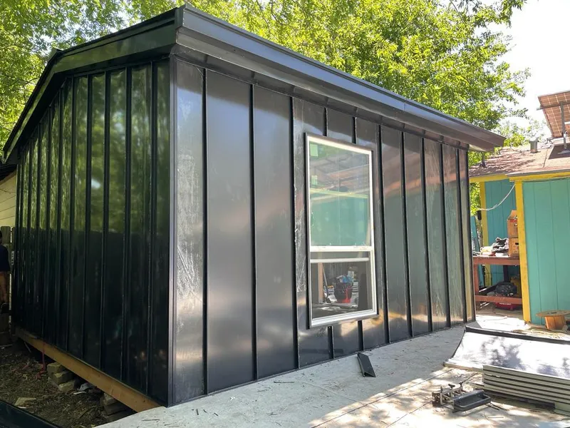 Black standing seam metal wall panels for Metal Roof Installation in Woodland